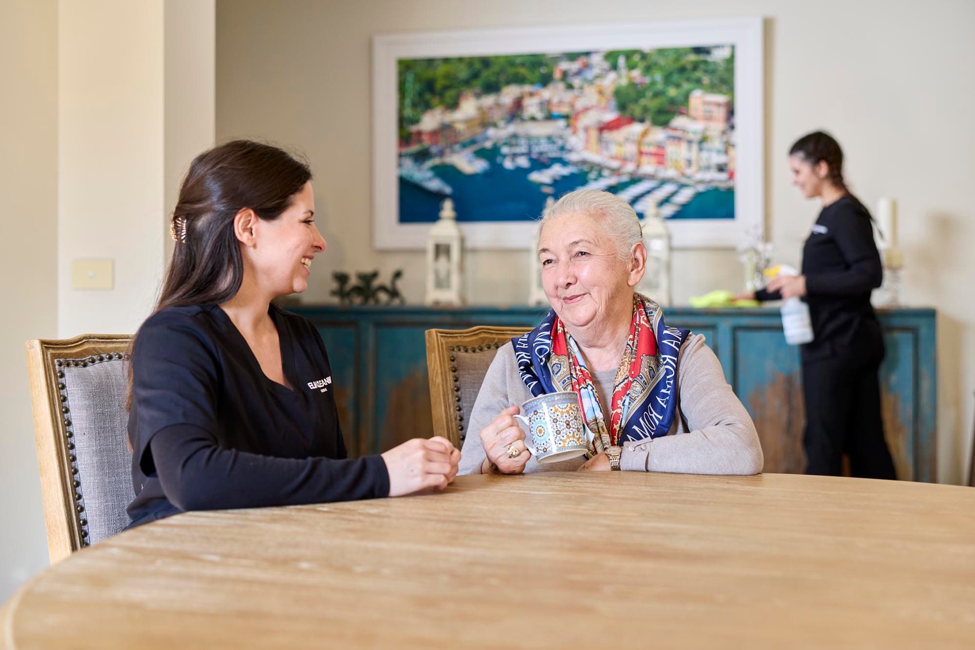 ELM Cleaning team member greeting homecare client at the door