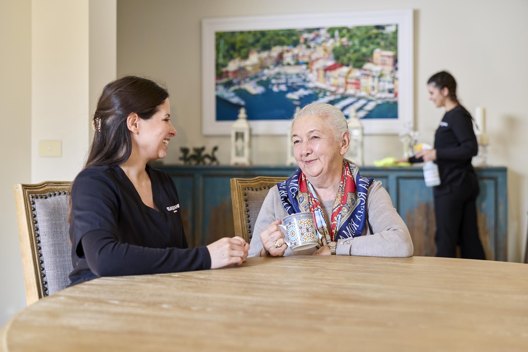 ELM Cleaning team member greeting homecare client at the door