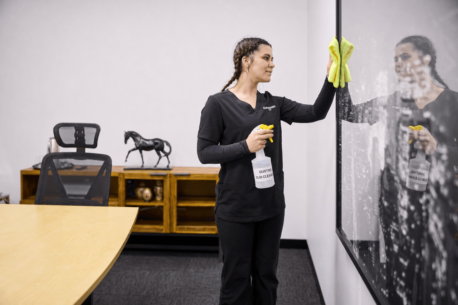 ELM Cleaning team member cleaning a workplace near Brighton